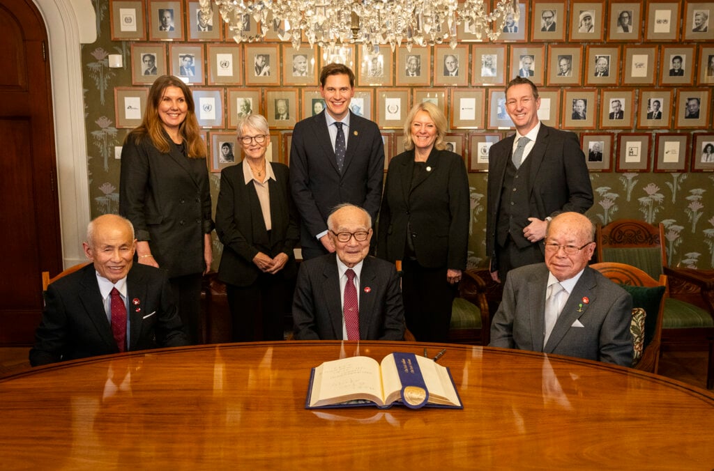 People gathering in front of guest book