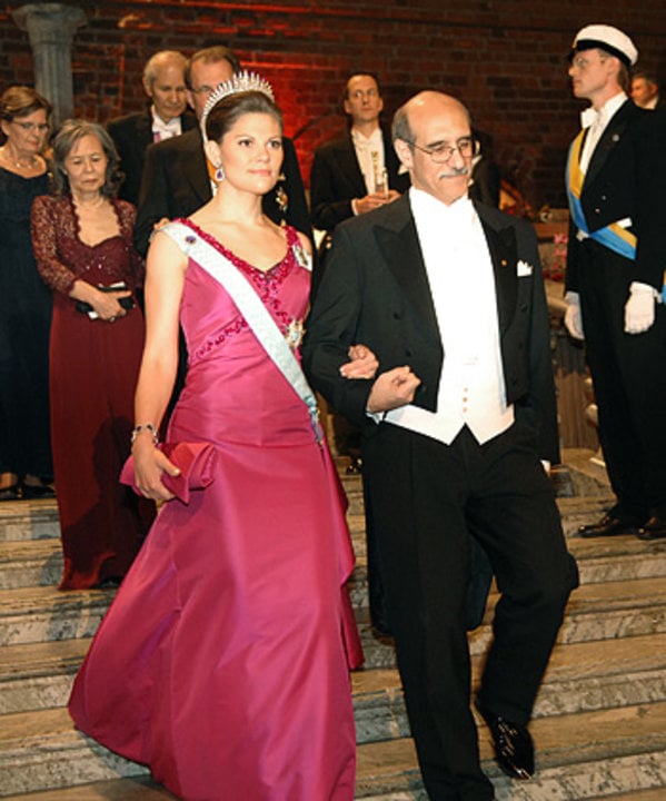 Swedish Crown Princess Victoria of Sweden is accompanied by Martin Chalfie down the stairs to the Nobel Banquet
