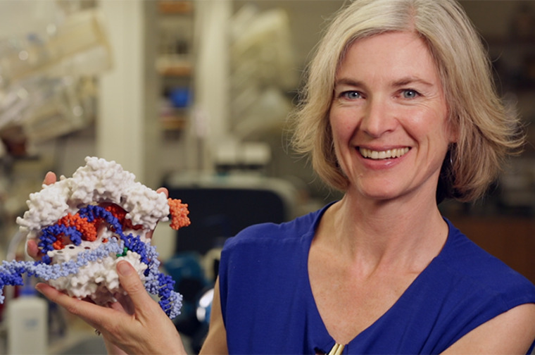 Biochemist Jennifer Doudna with a model of CRISPR-Cas9.