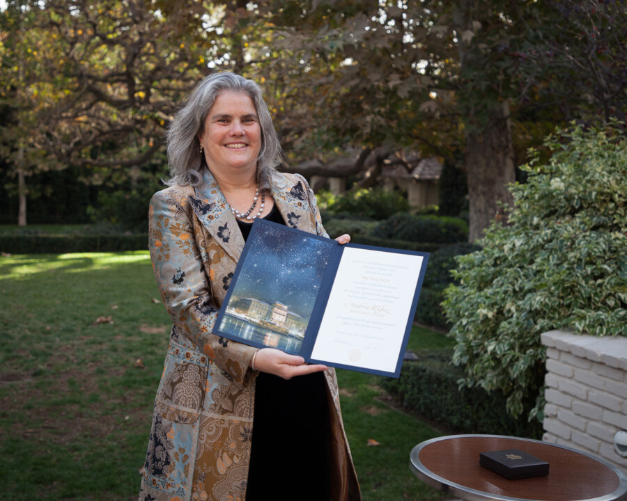 Andrea Ghez showing her Nobel Prize diploma.