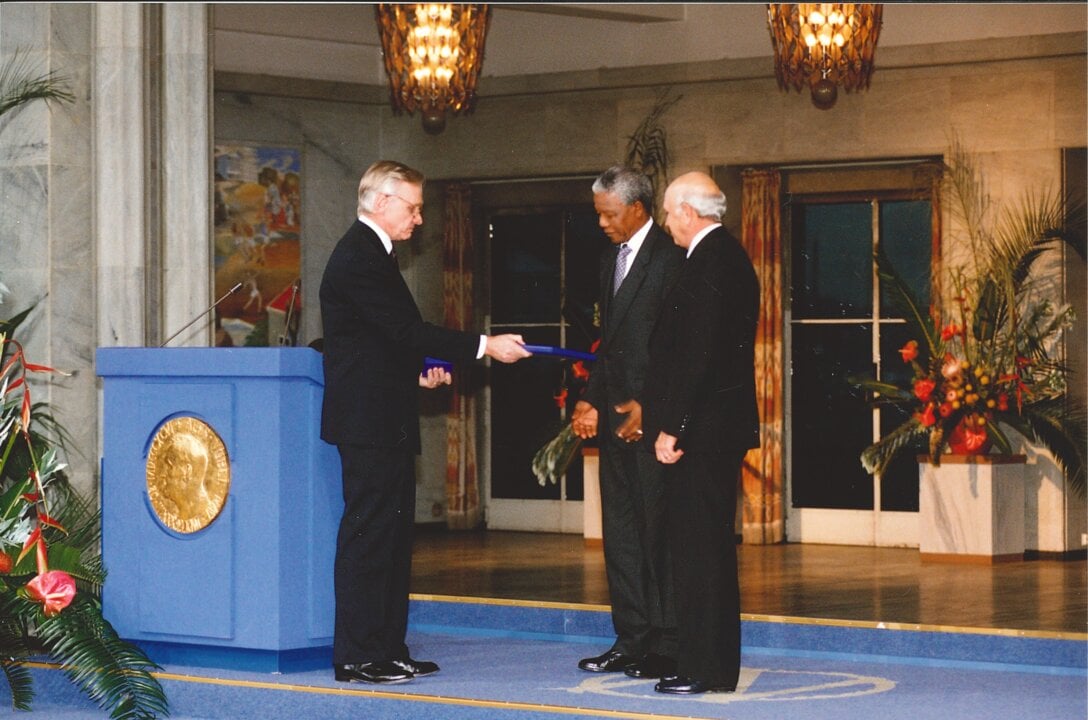 Nelson Mandela and F.W. de Klerk receiving their Nobel Prize medals and diplomas