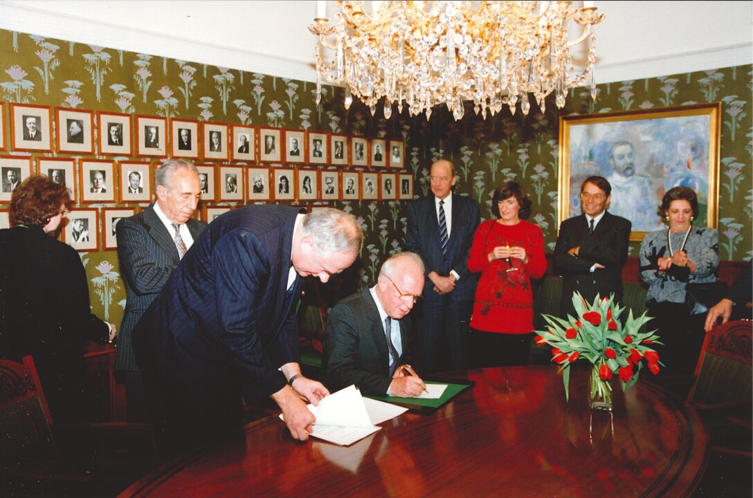 Yitzhak Rabin signing a guest