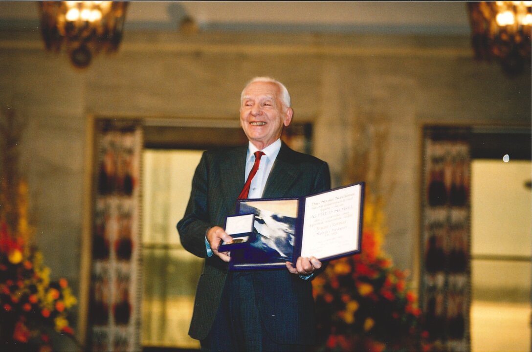 Joseph Rotblat showing his Nobel Prize medal and diploma