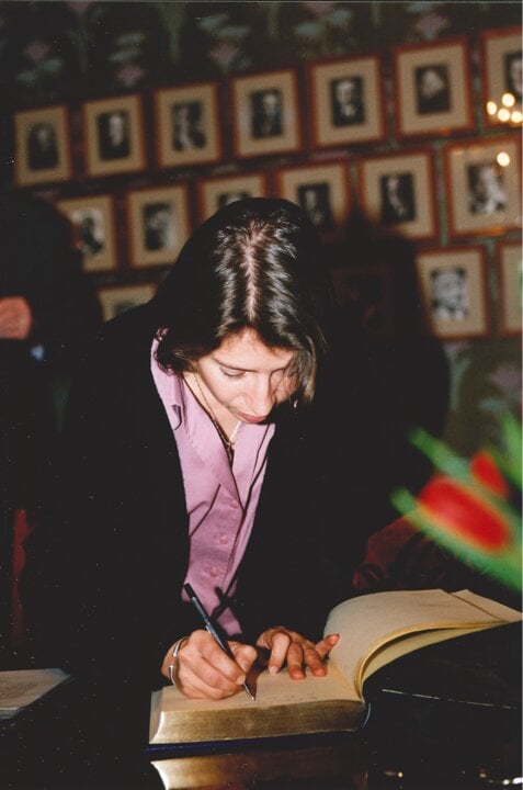 Dr. Marie-Eve Raguenaud signing the guest book