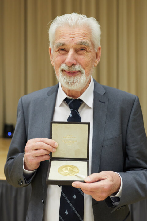 Klaus Hasselmann receiving his Nobel Prize medal and diploma