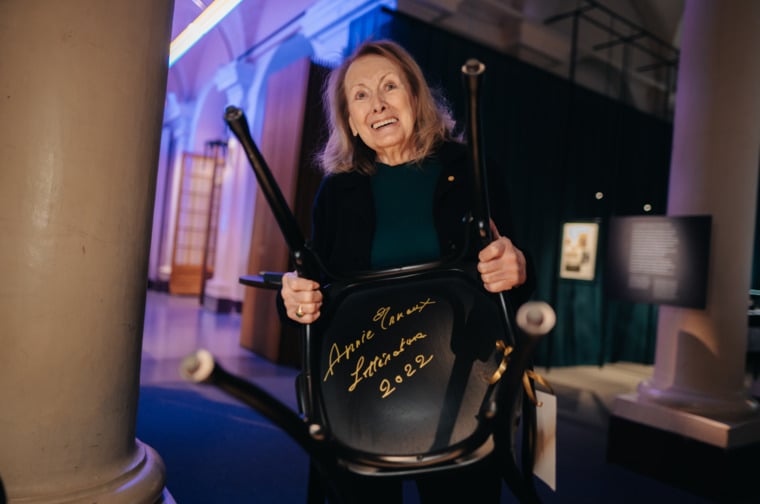 Annie Ernaux signs a chair at the Nobel Prize Museum