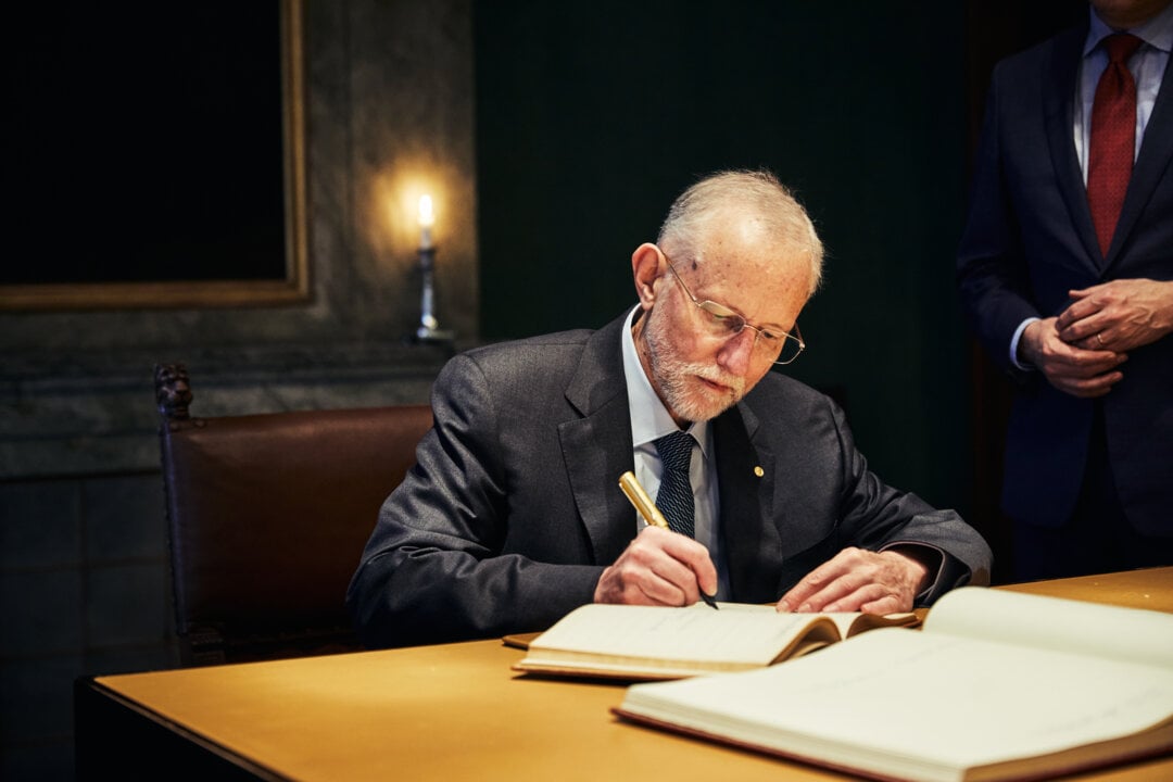 Charles M. Rice signs the Nobel Foundation's guest book