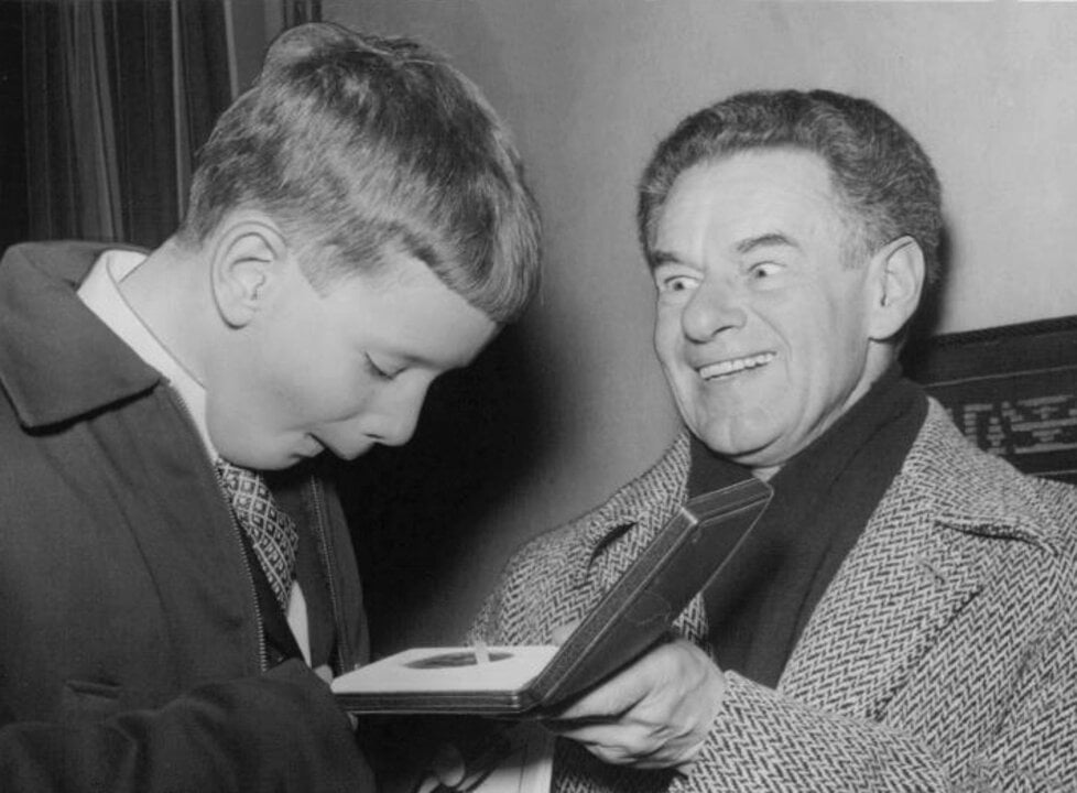Fritz Lipmann's son Steven admiring his father's Nobel Prize medal