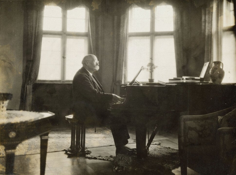 Henri La Fontaine at the piano