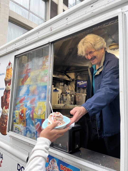 A man selling ice cream from a truck