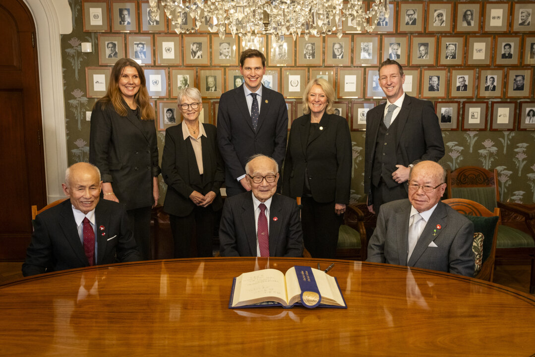 People gathering in front of guest book