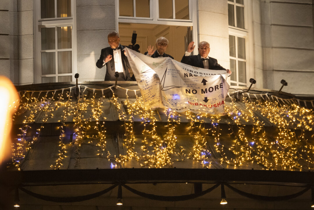 Three men on a balcony