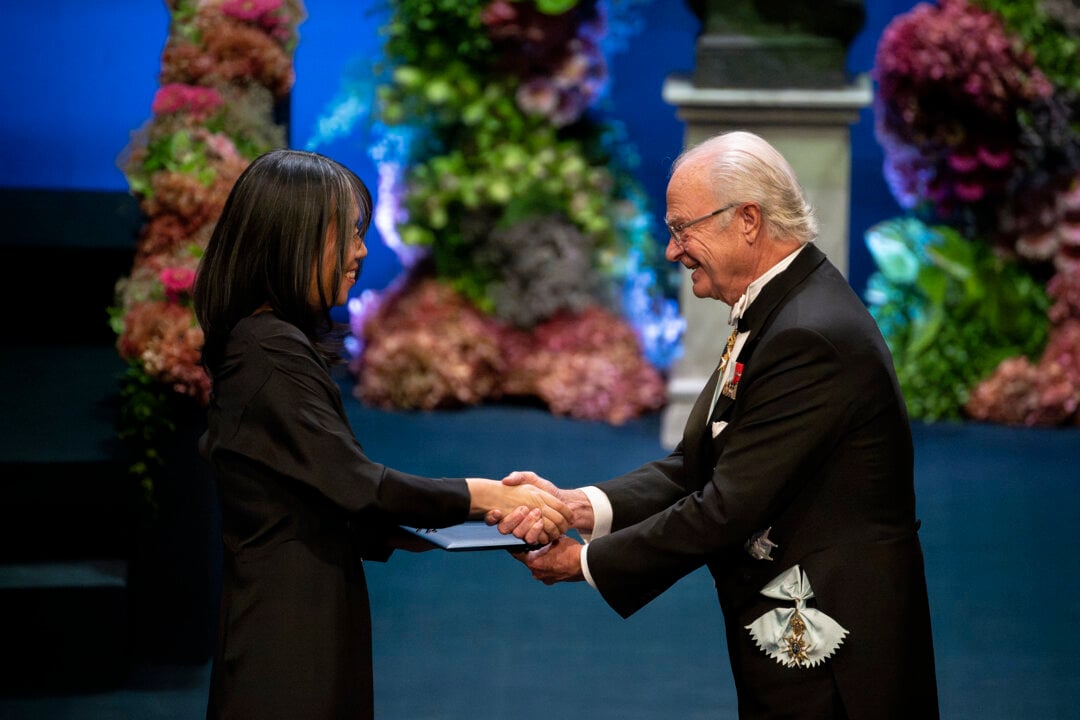 A woman and a man shaking hands