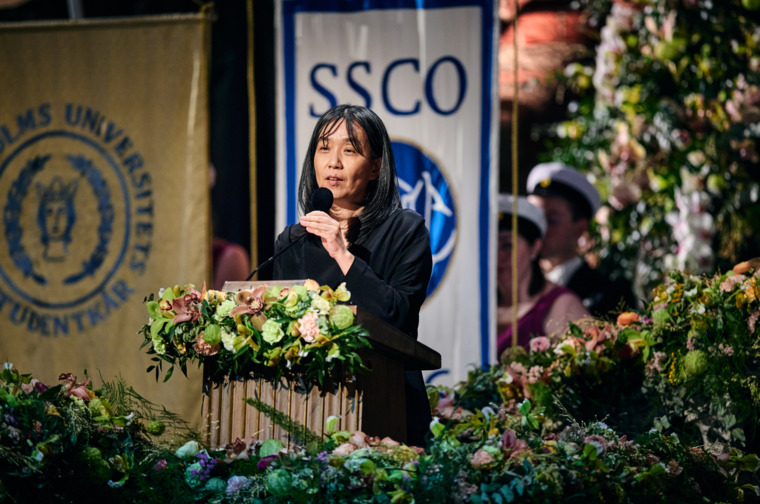 A woman speaking in a lectern