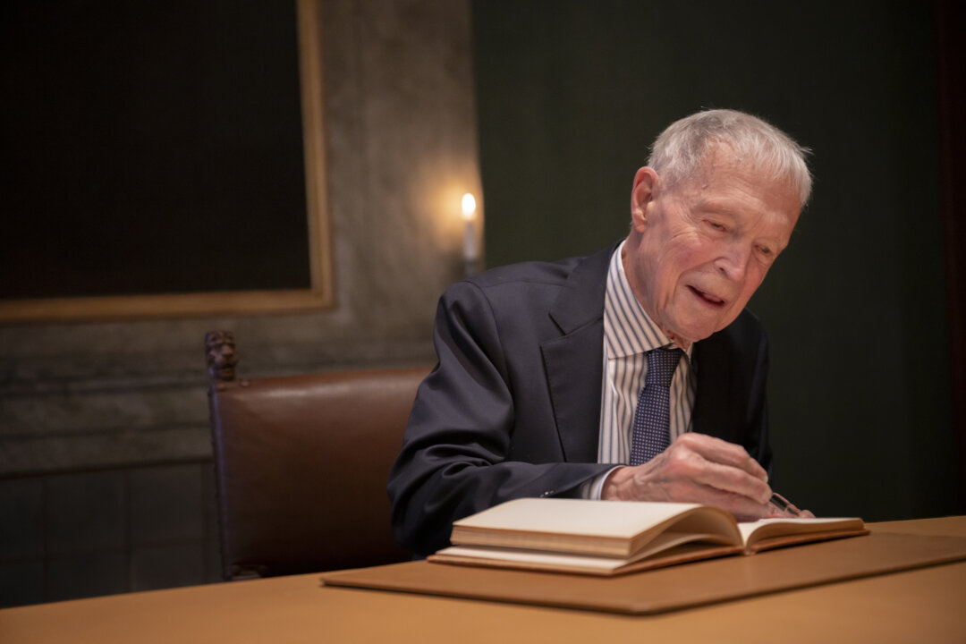 Man signing guestbook