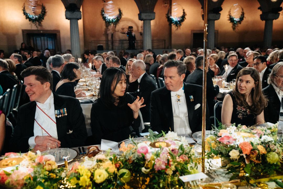 A woman and a man at a banquet table