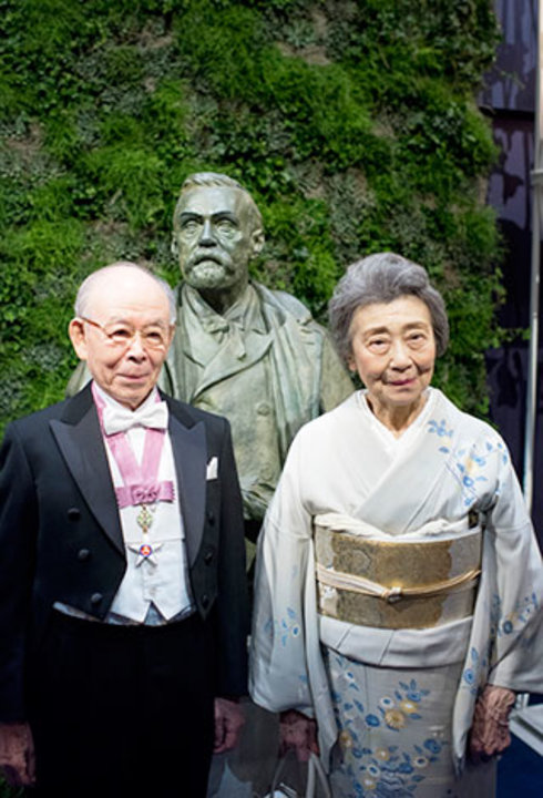 Isamu Akasaki with his wife, Mrs Ryoko Akasaki, on stage after the Nobel Prize Award Ceremony at the Stockholm Concert Hall.