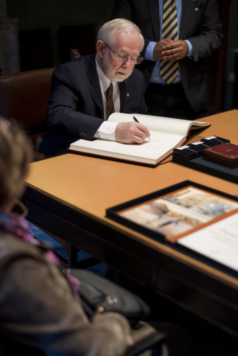Arthur B. McDonald signs the Nobel Foundation's guest book, signed by the Laureates since 1952, during his visit to the Nobel Foundation on 12 December 2015.