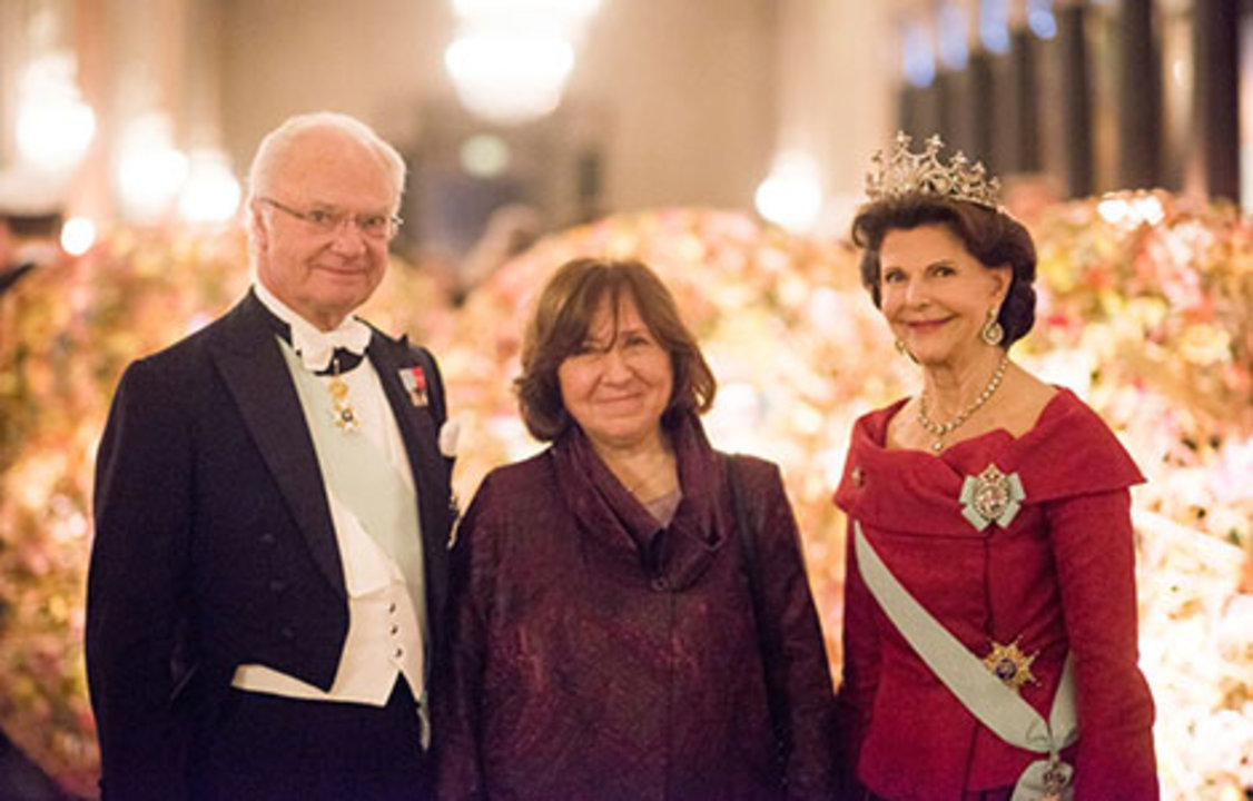 The Swedish Royal Family receives the Laureates and their significant others in the Prince's Gallery. From left to right: King Carl XVI Gustaf of Sweden, Literature Laureate Svetlana Alexievich and Queen Silvia of Sweden.