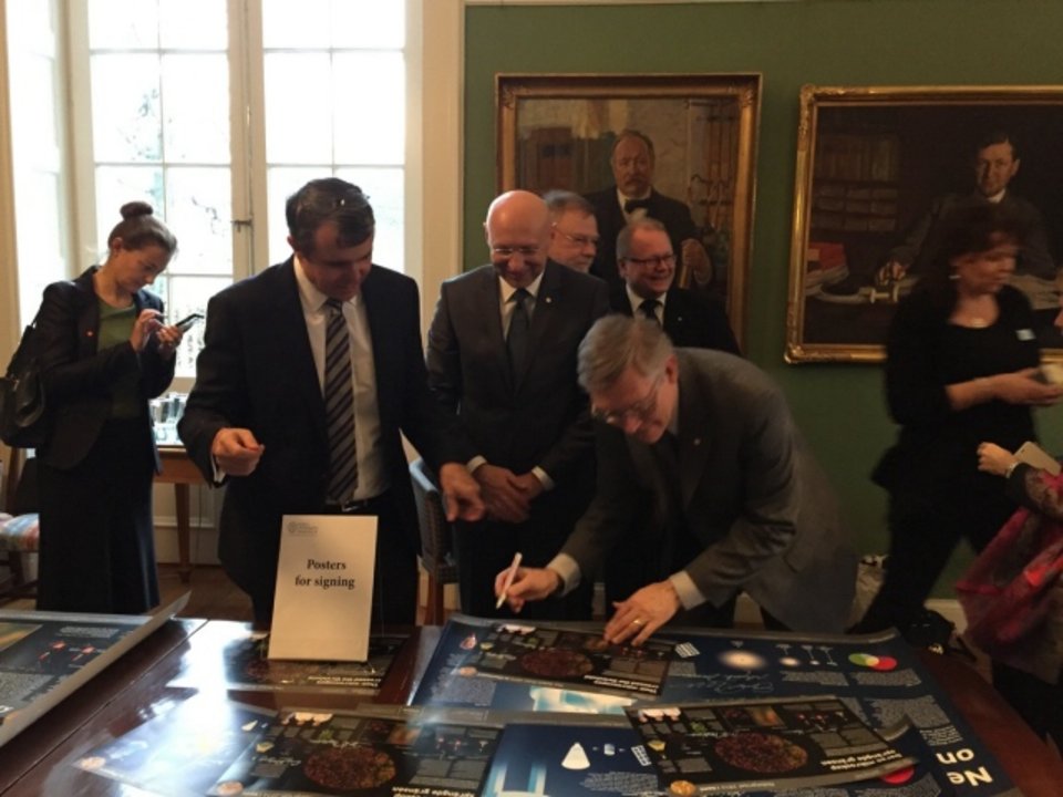 All three Chemistry Laureates signing posters at the Royal Swedish Academy of Sciences on 7 December 2014.
