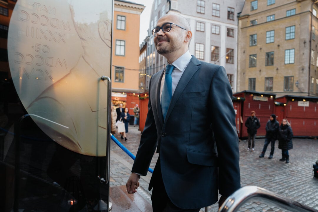 A man entering a door