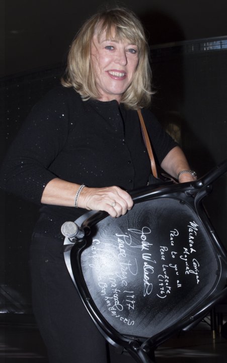 Jody Williams autographs a chair at Bistro Nobel at the Nobel Museum in Stockholm