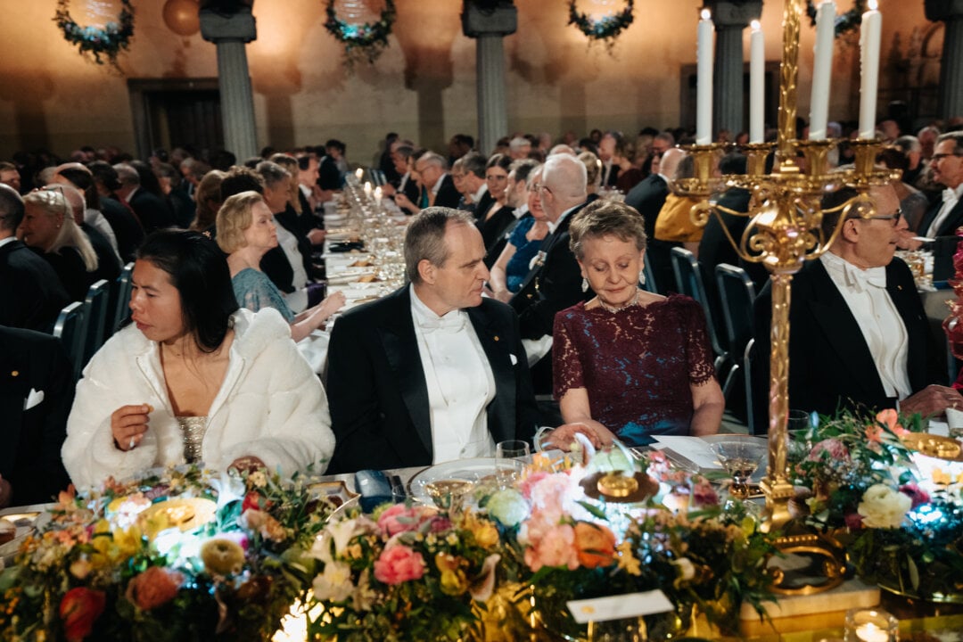 A man and a woman at a banquet table