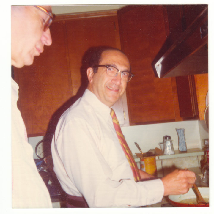 Salvador Luria cooking at his home
