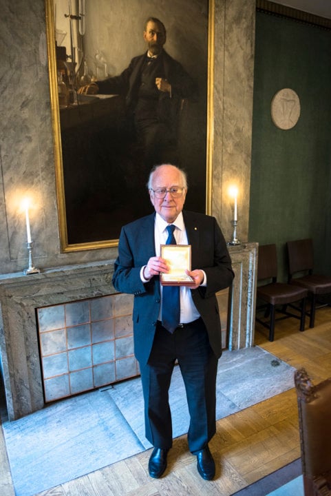 Peter Higgs showing his Nobel Medal during his visit to the Nobel Foundation