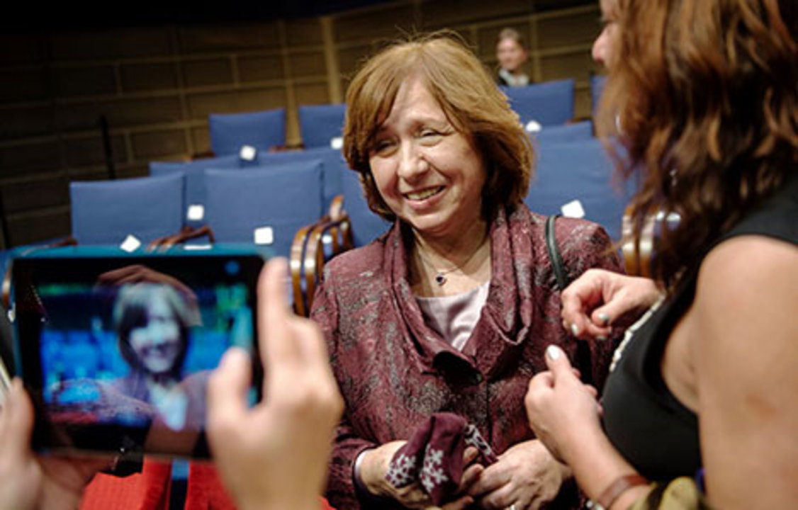 Family members and colleagues pour onto the stage to congratulate their Laureates. Svetlana Alexievich poses for a photo.