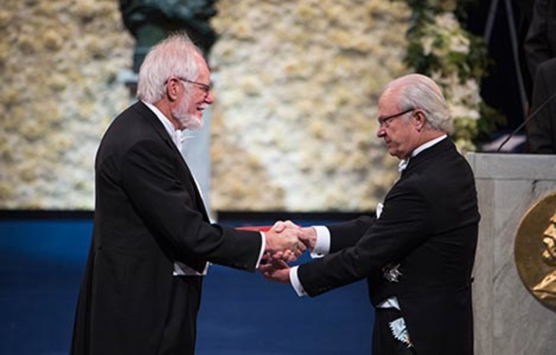 Jacques Dubochet receiving his Nobel Prize from H.M. King Carl XVI Gustaf of Sweden