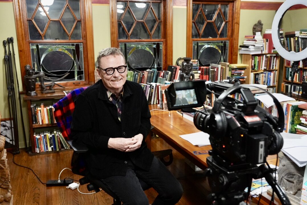 A man sitting at his desk