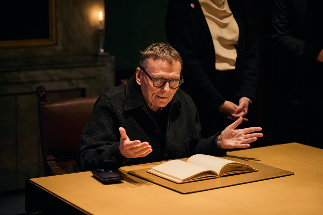 James A. Robinson takes a look in the guest book