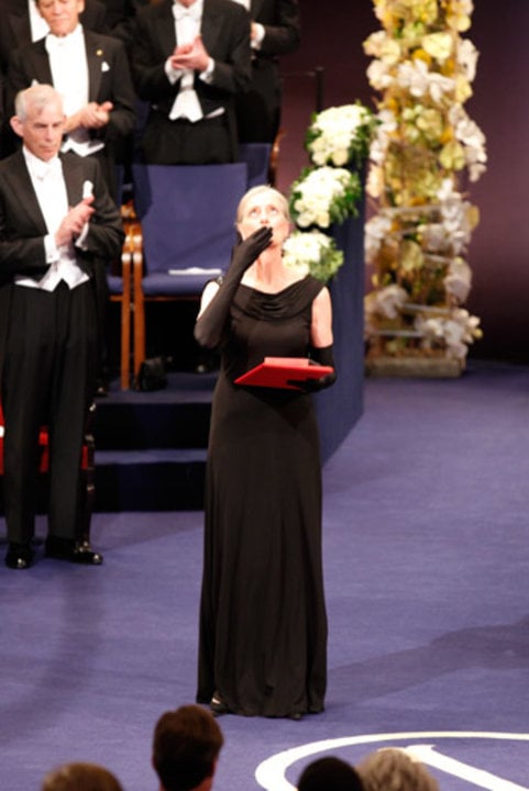 Mrs Claudia Steinman blows a kiss after receiving the Nobel Medal and Diploma on behalf of the late Professor Ralph M. Steinman