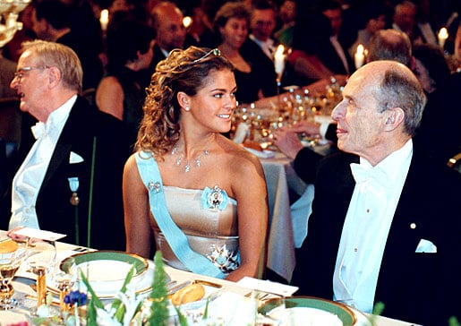 Princess Madeleine of Sweden seated between Nobel Laureate in Physiology or Medicine Paul Greengard and Arvid Carlsson at the Nobel Banquet.