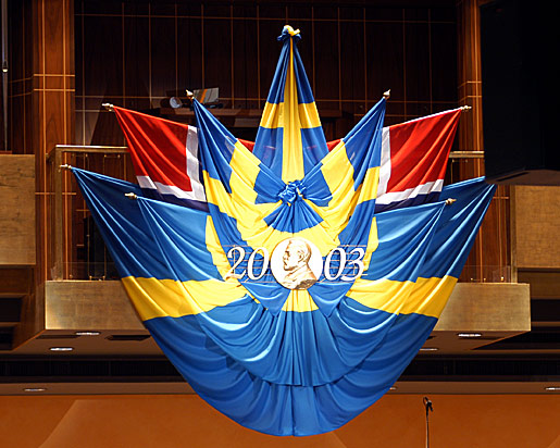 The Swedish flag above the stage of the Stockholm Concert Hall
