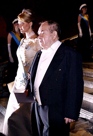 Sweden's Princess Madeleine is escorted by one of the Nobel Laureates in Physics, Alexei Abrikosov