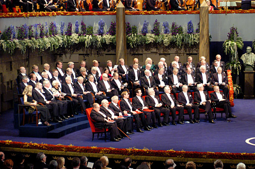 The 2003 Nobel Prize Award Ceremony begins. Onstage are the 2003 Nobel Laureates
