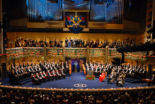 Onstage are the 2007 Nobel Laureates, the Swedish Royal Family, previous Nobel Laureates, and members of the Nobel Prize awarding institutions