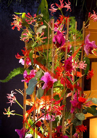 Many different types of flowers, including roses and orchids