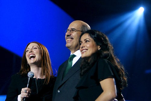Nobel Peace Prize Laureate Mohamed ElBaradei is congratulated by hosts Julianne Moore and Salma Hayek