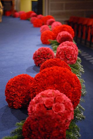 Flower arrangements made from carnations and roses in different shades of red