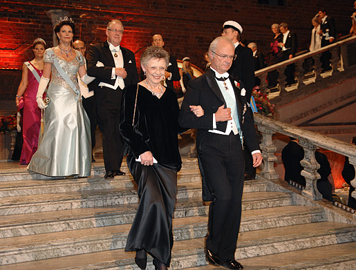 The Royal Family and other guests of honour make their entry down the stairs into the Blue Hall