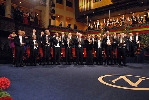 The 2008 Nobel Laureates rise for the Swedish national anthem