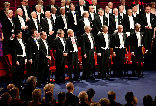The 2010 Nobel Laureates rise for the Swedish national anthem
