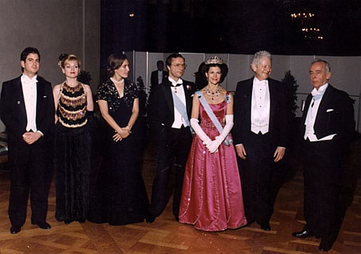 Their Majesties King Carl XVI Gustaf (center) and Queen Silvia of Sweden (third from right) pose with Leon Lederman (second from right) and his family. They are joined by Lars Gyllensten (right), Chairman of the Nobel Foundation and member of the Swedish Academy.