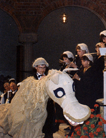 A straw horse is featured in the musical entertainment.