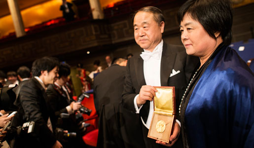 Mo Yan with his wife Mrs Qinlan Du, showing his Nobel Prize Medal after the Nobel Prize Award Ceremony