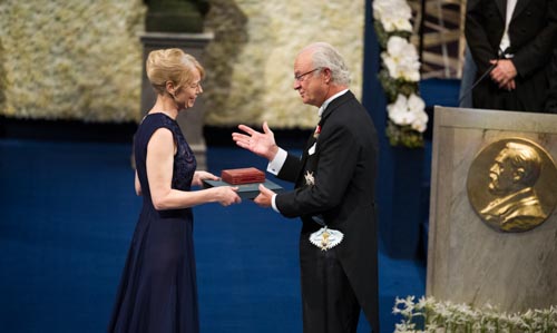 Mrs Jenny Munro receiving the Nobel Medal and Diploma on behalf of her mother Alice Munro