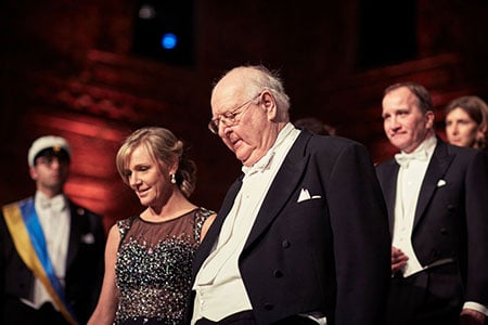 Angus Deaton and Jenni Ahlin, journalist, proceed into the Blue Hall of the Stockholm City Hall for the Nobel Banquet on 10 December 2015.
